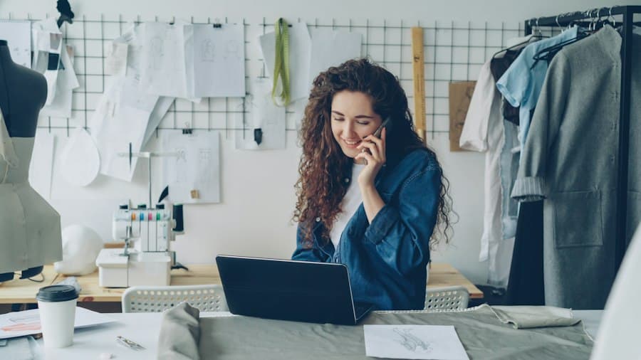 A designer on the phone at her studio desk